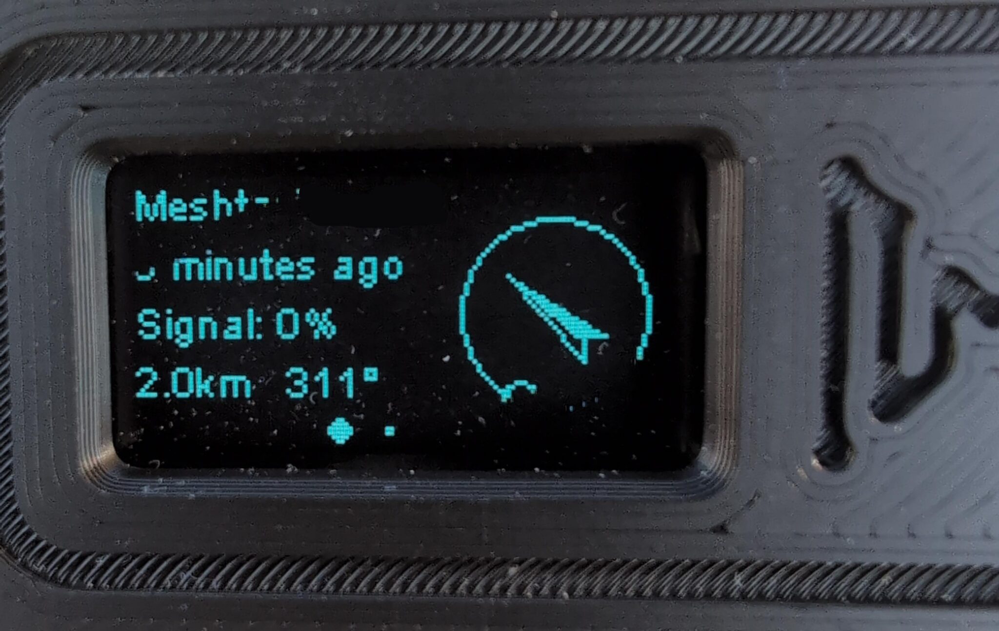 Meshtastic screen seen on a tiny LoRa node. Shows 2km range achieved when signal drop to 0.