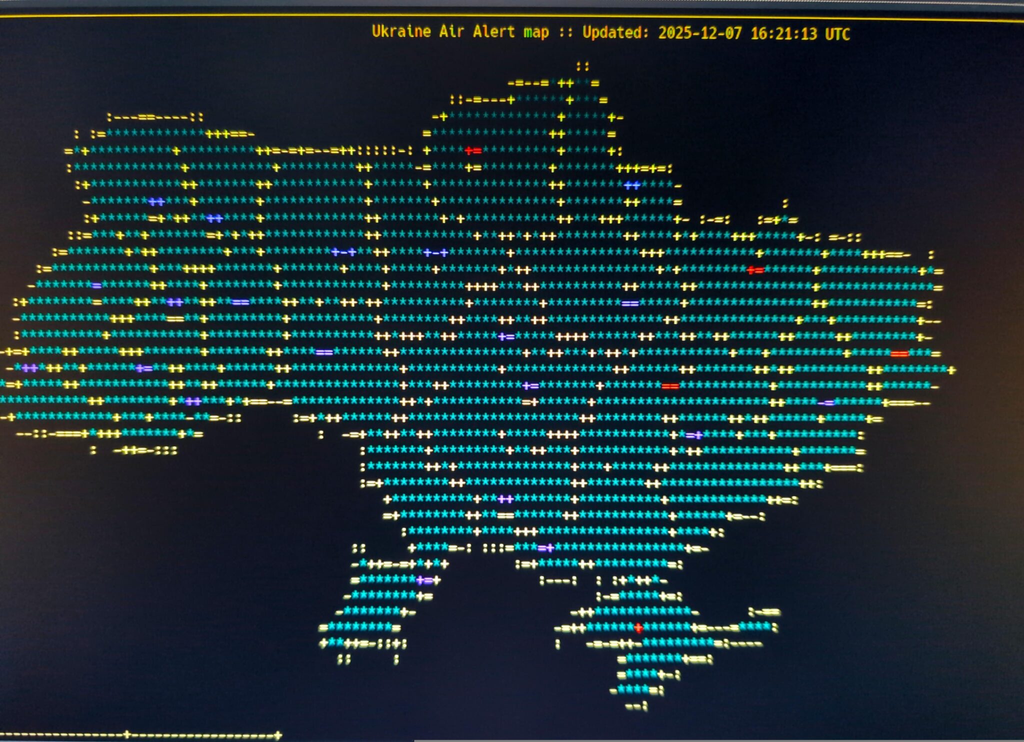 Ascii art map of Ukraine with "Air Alert Map" across the header. Includes different colors and symbols indicating different combat zones